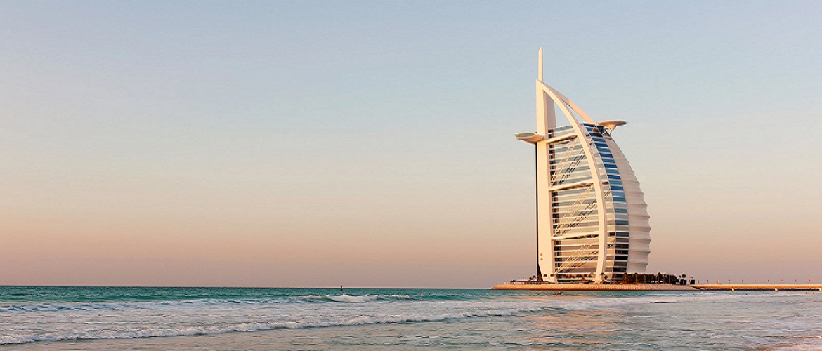 View of Burj al Arab hotel and beach in evening in Dubai in United Arab Emirates